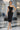 BLACK COTTON MIDI DRESS WITH ASYMMETRICAL SHOULDERS AND STRAP BAROQUE PEARL - ESSENTIALS JIORO ПАМУЧНА МИДИ РОКЛЯ С АСИМЕТРИЧНИ РАМЕНЕ И ПРЕЗРАМКА BAROQUE PEARL - ESSENTIALS JIORO
