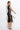 BLACK COTTON MIDI DRESS WITH ASYMMETRICAL SHOULDERS AND STRAP BAROQUE PEARL - ESSENTIALS JIORO ПАМУЧНА МИДИ РОКЛЯ С АСИМЕТРИЧНИ РАМЕНЕ И ПРЕЗРАМКА BAROQUE PEARL - ESSENTIALS JIORO