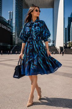 FLARED LYOCELL MIDI DRESS WITH BOW AND VOLUMINOUS SLEEVES - SHADES OF BLUE JIORO РАЗКРОЕНА МИДИ РОКЛЯ ОТ ЛИОСЕЛ С ПАНДЕЛКА И ОБЕМНИ РЪКАВИ - SHADES OF BLUE JIORO